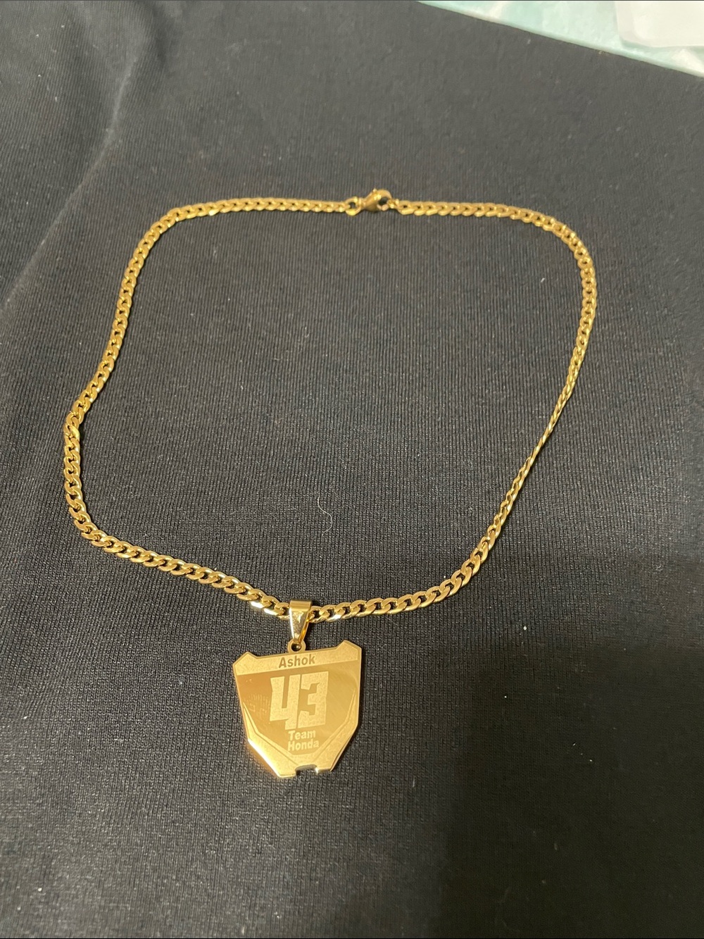 Gold Tone Pendant Necklace with '43' Shield Charm